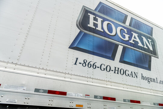 Garrisonville, USA - May 27, 2025: Hogan truck sign for work job advertisement, phone number for trucking business company