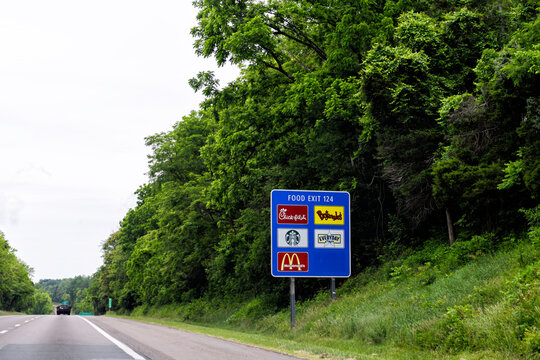 Charlottesville, USA - May 27, 2025: Food exit sign at Virginia highway road i-64 for Chick-fil-a, Bojangle's, Starbucks and McDonald's fast food