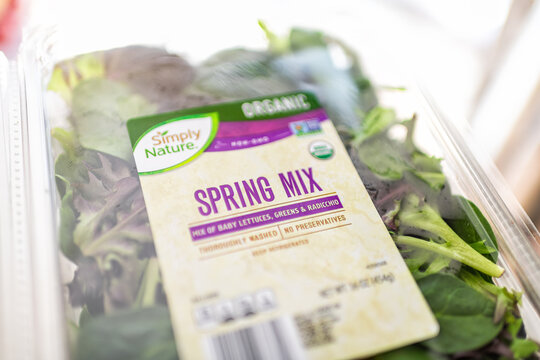 Roseland, USA - February 22, 2025: Plastic tray box of organic washed Aldi brand private label of Simply Nature spring mix vegetable green leafy salad