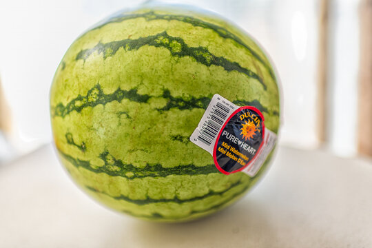 Roseland, USA - March 10, 2025: Sticker sign label for Dulcinea pure heart small personal mini seedless watermelon with stripes green rind