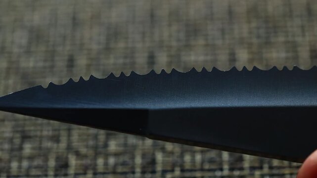 A detailed view of a knife's sharp edge, ideal for use in product  or crime scene scenarios