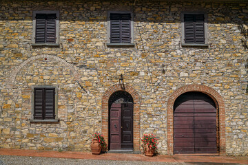Obraz premium Facade of an old stone villa at a vineyard, Chianti wine Region, Tuscany, Italy