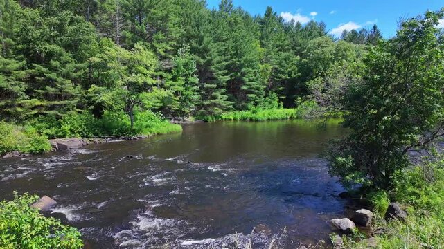Eels Creek river at summer, North Kawartha, Ontario near Bancroft to Upper Stoney Lake area. Scenic waterway parallels Highway 28 and crown land wilderness. Great destination canoe trip activities.