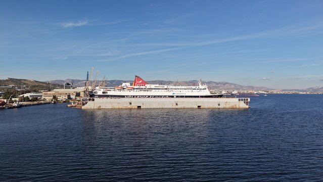 Hellenic seaways ferry in dry dock at piraeus shipyard, greece &mdash; aerial drone view of maritime vessel undergoing hull maintenance and repair