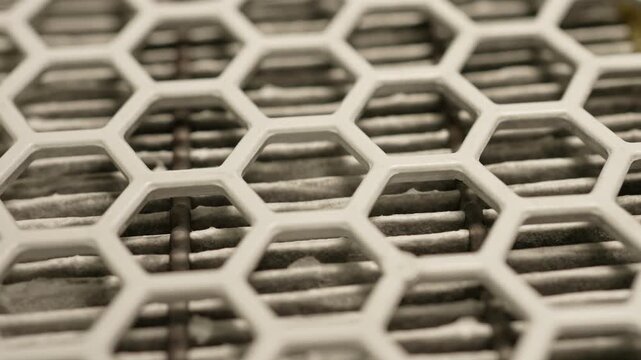 High efficiency particulate air filter macro close up. HEPA air filter to stop spread of microscopic pollen grains and prevent pollen allergy. Filter for healing hay fever or allergic rhinitis.