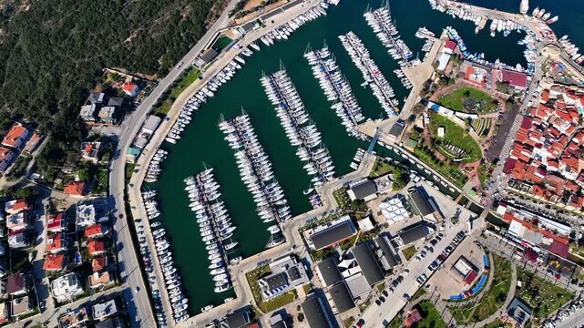 Peaceful Aerial View of Teos Marina and Sığacık, Izmir Turkey - Aerial view of Teos Marina and Sığacık in Izmir, Turkey, featuring a peaceful harbor, boats and clear blue Aegean Sea.