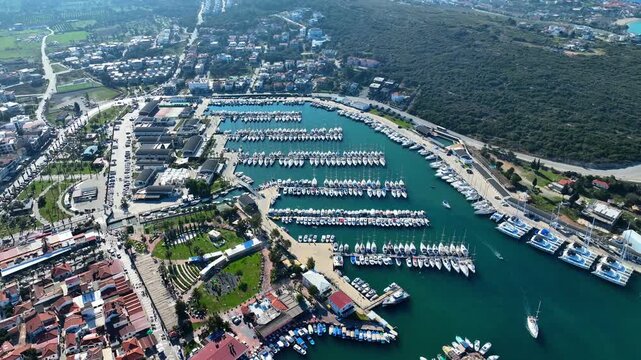 Peaceful Aerial View of Teos Marina and Sığacık, Izmir Turkey - Aerial view of Teos Marina and Sığacık in Izmir, Turkey, featuring a peaceful harbor, boats and clear blue Aegean Sea.