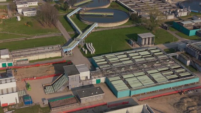 Drone view of an advanced wastewater treatment plant in Italy using circular economy principles to generate energy from waste and reduce emissions.