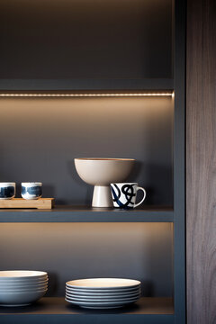 Modern kitchen cupboard with elegant tableware