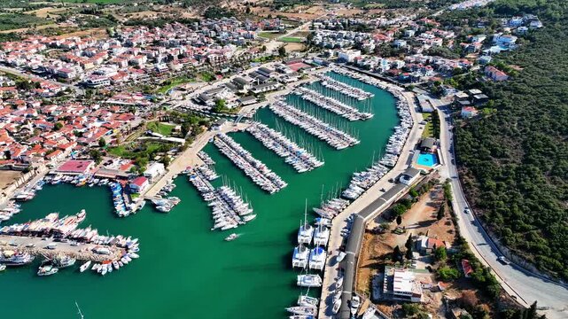 Peaceful Aerial View of Teos Marina and Sığacık, Izmir Turkey - Aerial view of Teos Marina and Sığacık in Izmir, Turkey, featuring a peaceful harbor, boats and clear blue Aegean Sea.