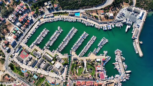 Peaceful Aerial View of Teos Marina and Sığacık, Izmir Turkey - Aerial view of Teos Marina and Sığacık in Izmir, Turkey, featuring a peaceful harbor, boats and clear blue Aegean Sea.