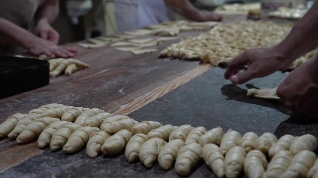baker making argentinian croissant
