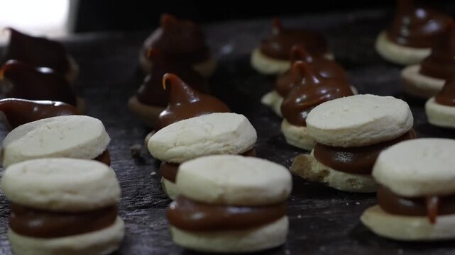 Argentinian alfajores filled with dulce de leche.
close-up of dulce de leche alfajores