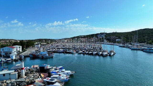 Peaceful Aerial View of Teos Marina and Sığacık, Izmir Turkey - Aerial view of Teos Marina and Sığacık in Izmir, Turkey, featuring a peaceful harbor, boats and clear blue Aegean Sea.