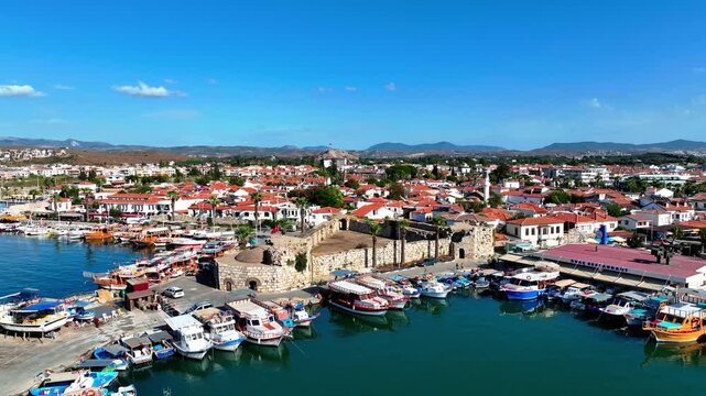 Peaceful Aerial View of Teos Marina and Sığacık, Izmir Turkey - Aerial view of Teos Marina and Sığacık in Izmir, Turkey, featuring a peaceful harbor, boats and clear blue Aegean Sea.