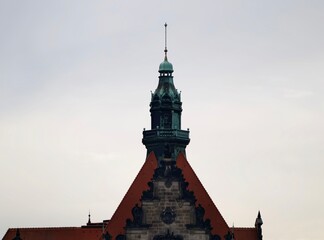 Fototapeta premium Skyline drawing mood. Overcast sky frames student sketching building ornament and spire silhouette