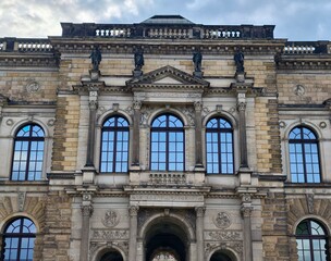 Fototapeta premium Grand classical building design. Ornate neoclassical facade featuring detailed sculptures and arches