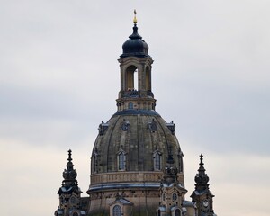 Decorative stone monument with detailed features. Artistic dome with weathered textures and intricate carvings © Vladimir