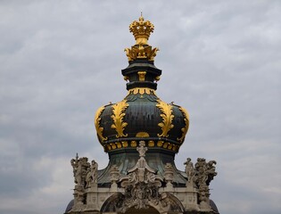 Spectacular baroque crown embellishing rooftop with exquisite sculptures and intricate decorative features © Vladimir
