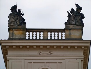 Urban rooftop range displaying weathered stone sculptures with atmospheric sky contrast and cinematic appeal © Vladimir