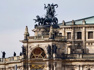 Artistic silhouette displays victorious chariot with majestic elegance opposite cloudy sky © Vladimir