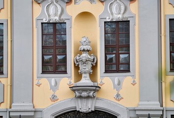 Elegant historic facade. Architectural design showcasing detailed reliefs and symmetrical features © Vladimir