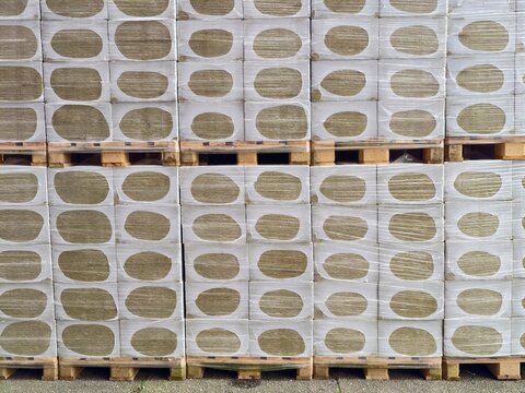 Largescale storage units stacked systematically on pallets prepared for timely delivery and distribution