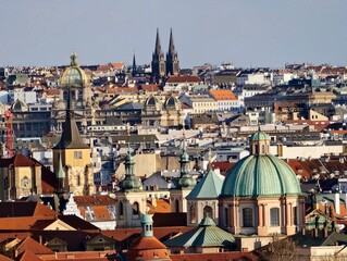 Ancient domes and spires present. City skyline accented by copper domes and decorative facades © Vladimir