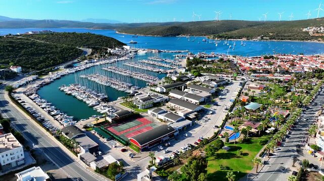 Peaceful Aerial View of Teos Marina and Sığacık, Izmir Turkey - Aerial view of Teos Marina and Sığacık in Izmir, Turkey, featuring a peaceful harbor, boats and clear blue Aegean Sea.