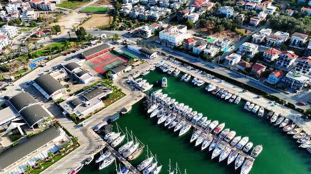 Peaceful Aerial View of Teos Marina and Sığacık, Izmir Turkey - Aerial view of Teos Marina and Sığacık in Izmir, Turkey, featuring a peaceful harbor, boats and clear blue Aegean Sea.