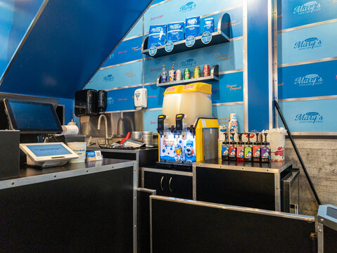 Quebec, CANADA, 28 February 2026 : Popcorn Shop Counter with Slushie Machine and Supplies
