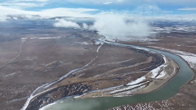 Aerial view of the First Bend of the Yellow River in Zoige, winter landscape of meandering river and frozen wetlands on the Tibetan Plateau