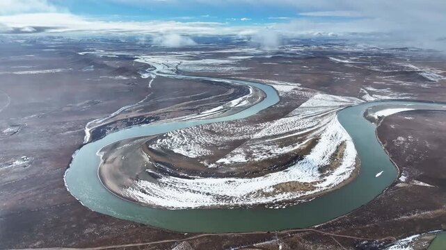 Aerial view of the First Bend of the Yellow River in Zoige, winter landscape of meandering river and frozen wetlands on the Tibetan Plateau