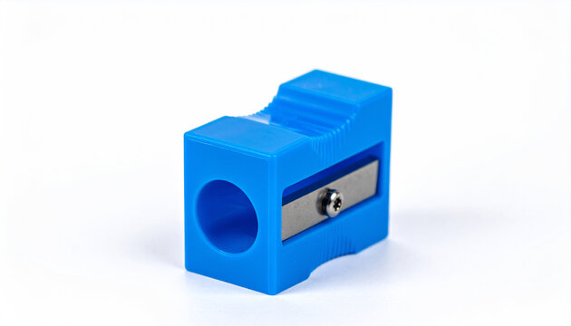 Blue plastic pencil sharpener with metal blade angled on white background