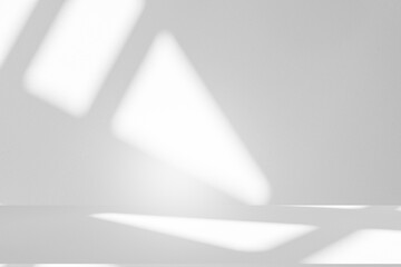 Naklejka premium Wall interior background, studio and backdrops show products.with shadow from window color white and grey. background for text insertion and presentation product