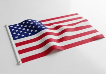Fototapeta premium A small american flag waving on a white surface