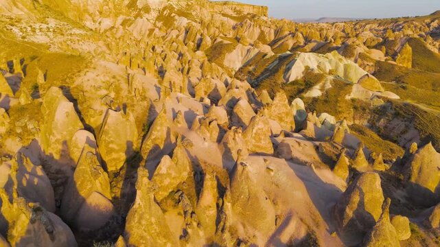 Goreme, Nevsehir, Turkey. Sunset aerial view of Devrent Imagination Valley with vibrant colored rock formations and surreal landscapes in Cappadocia.. Aerial View