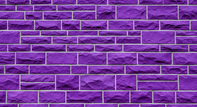 A purple brick wall with white grout