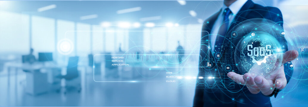 Developer holding software as a service panel showing business growth graph with cloud system, online platform, subscription software, digital network, SaaS technology concept.