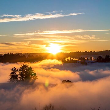 Sunrise over a misty valley