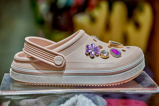 Ambato, Ecuador - February 06, 2025: Crocs Classic store display featuring Crocs Crush platform clog embellished with gem-style Jibbitz at Mall de los Andes, showcasing vibrant footwear design