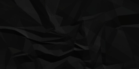 Obraz premium Abstract black parchment wrapping crumpled paper texture. creased page wrinkle retro rough distressed damage paper texture background.