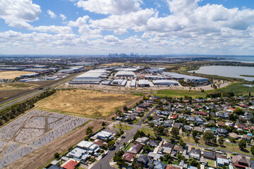 altona melbourne aerial view suburb city industrial area residential neighborhood warehouses open field highway skyline urban landscape agriculture victoria australia © Brett Price