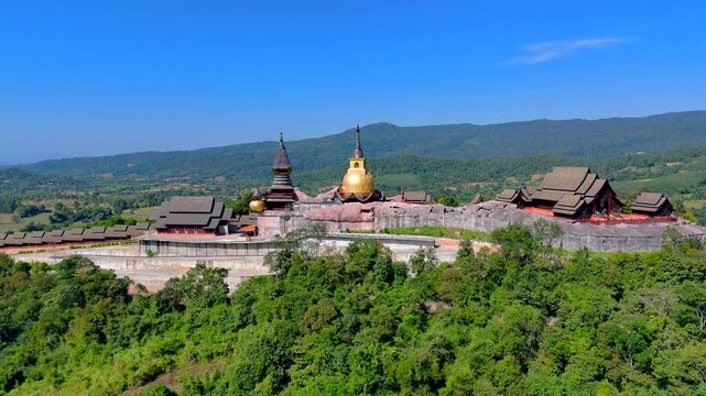 22,Mar,2026,Phu Ruea Loei Thailand ,Wat Somdet Phu Ruea Ming Muang: In front of the temple built of teak wood and there is a beautiful viewpoint at Loei Province, Thailand
