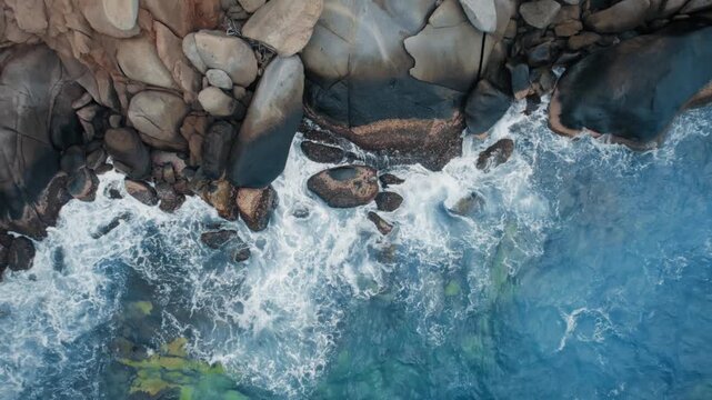 Aerial Top-Down View of Waves Crashing on Tayrona National Park Coastl