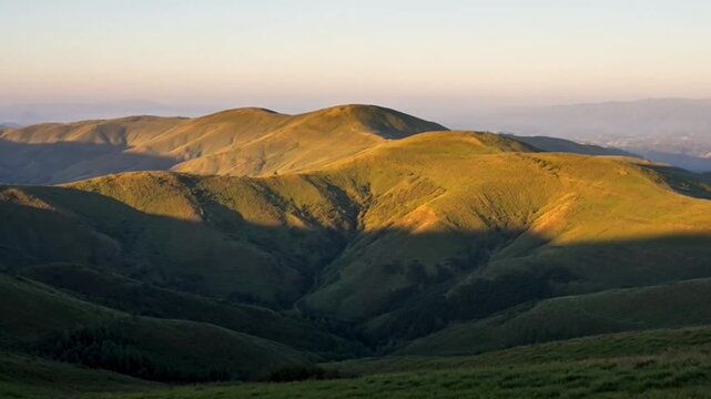 Mountain range illuminated by sunset light with scenic landscape view