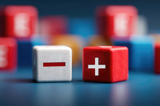 plus and minus signs on wooden cubes