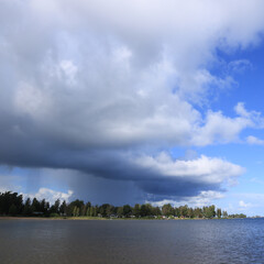 Obraz premium Cloud burst over Lake Vanern, Vita Sandar, mellerud, Sweden.