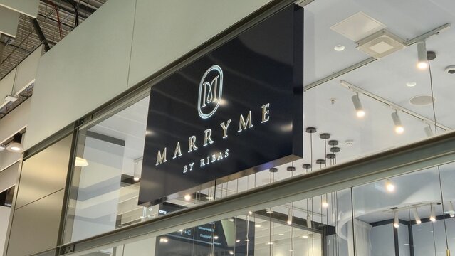 Vilnius Lithuania - 21.03.2026, Marryme by ribas illuminated boutique sign on a modern glass storefront with bright ceiling lights inside a shopping mall