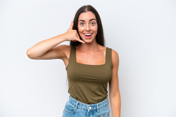 Fototapeta premium Young caucasian woman isolated on white background making phone gesture. Call me back sign
